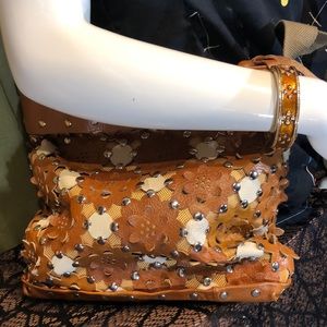 Leather purse & enamel bracelet duo. Hand cut